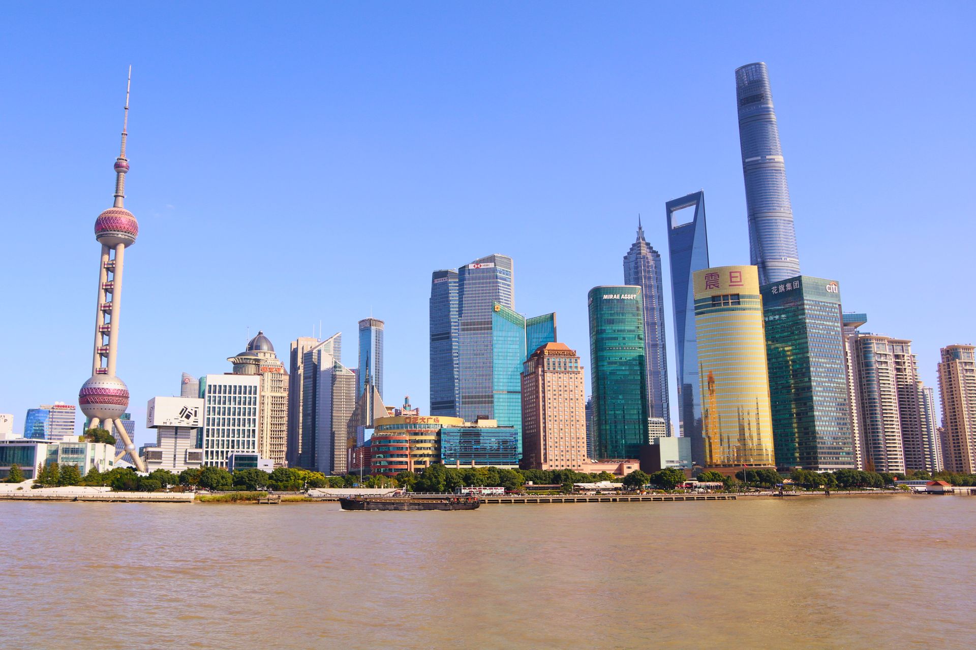 Shanghai’s Pudong skyline and Oriental Pearl Tower across the Huangpu River